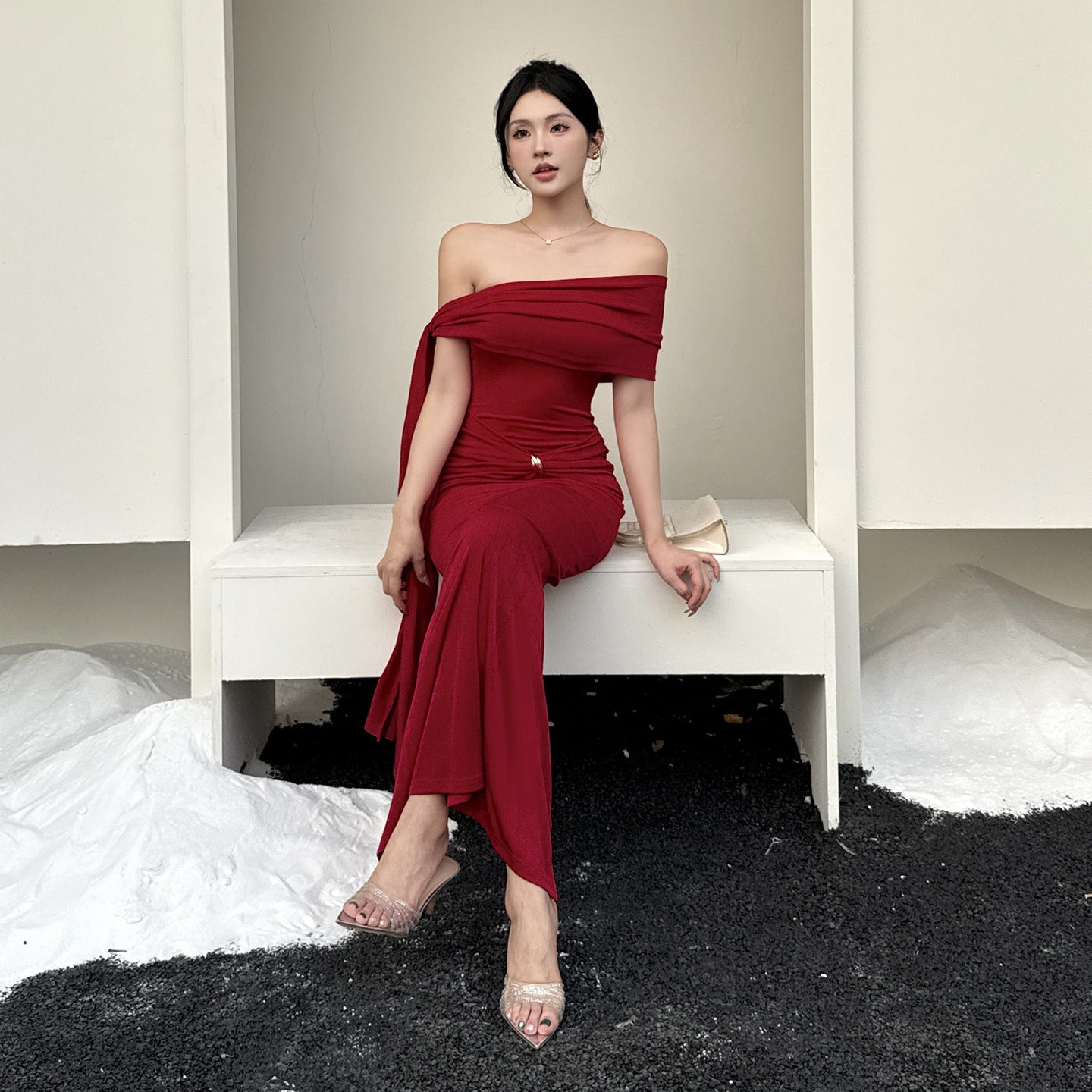 Waist tied dress with slanted shoulders and exposed shoulders