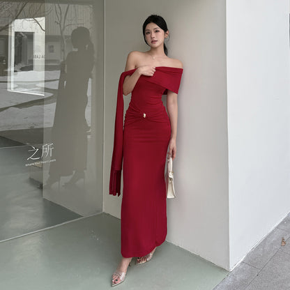 Waist tied dress with slanted shoulders and exposed shoulders