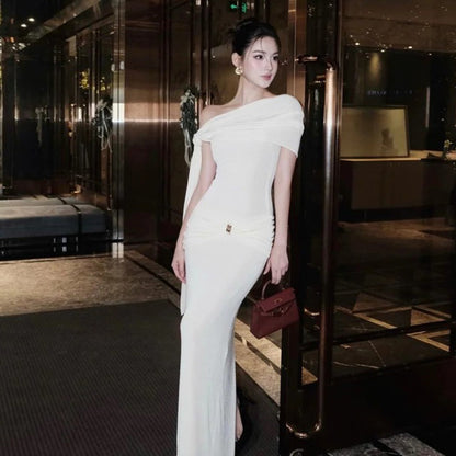 Waist tied dress with slanted shoulders and exposed shoulders