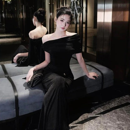 Waist tied dress with slanted shoulders and exposed shoulders